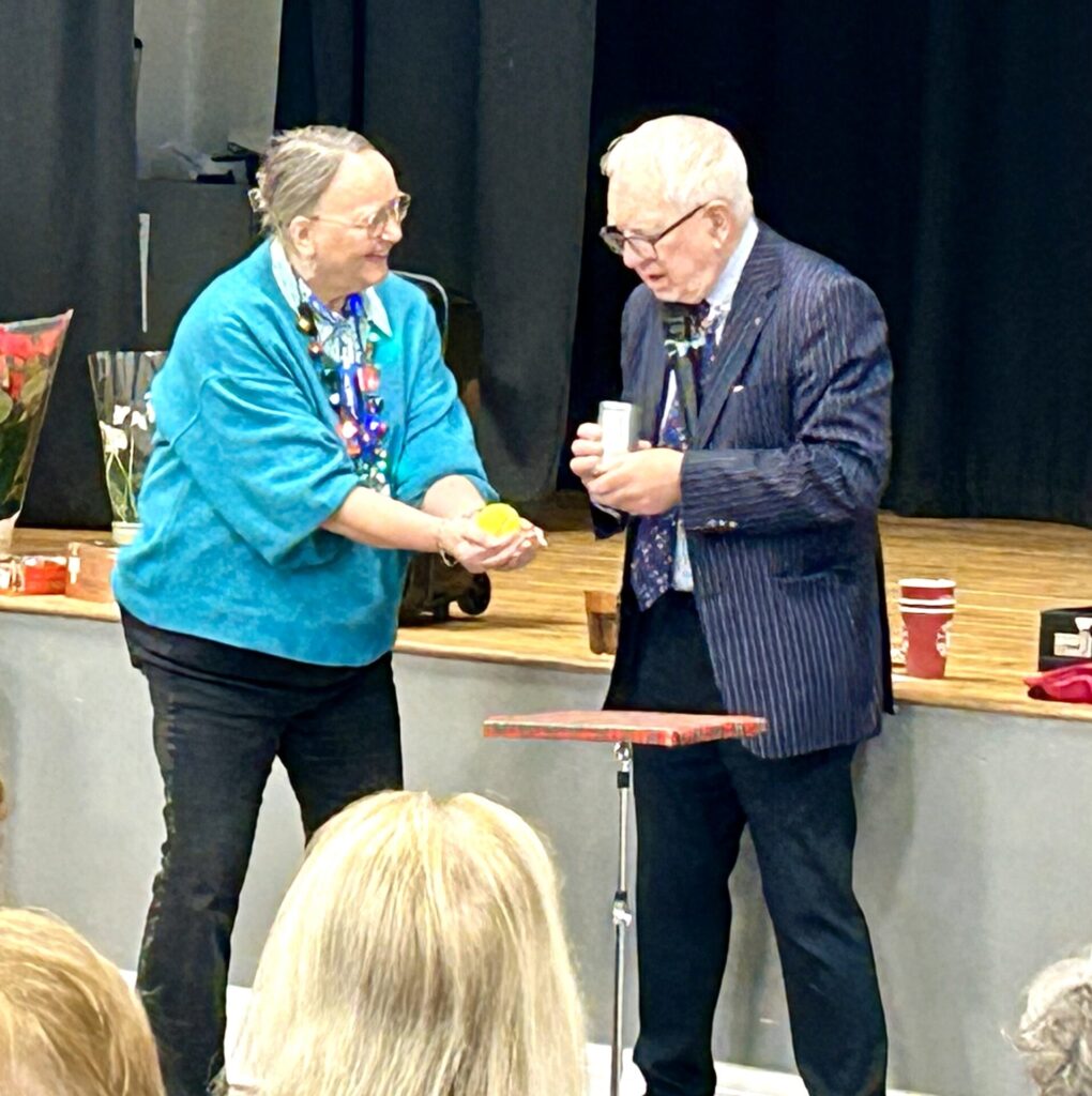 John Richard with Linda our Chair helping with his magic.